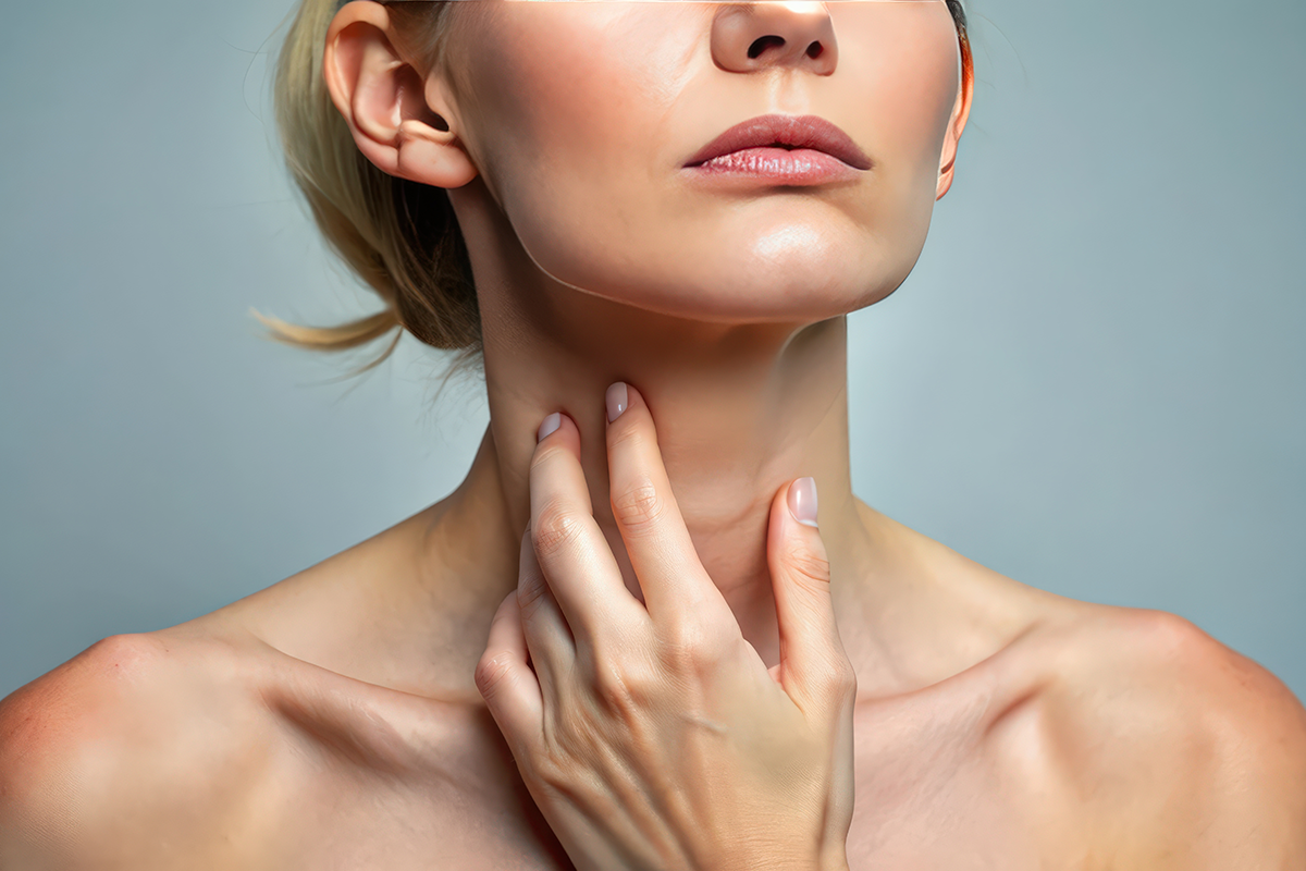 Close-up view of a Caucasian woman touching loose skin on neck